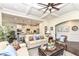 Inviting living room featuring hardwood floors, sofas, decorative pillows, and open access to the kitchen at 5158 Montview Way, Noblesville, IN 46062
