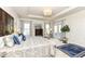 Spacious main bedroom with tray ceilings, a chandelier, a sitting area, and natural light at 5158 Montview Way, Noblesville, IN 46062
