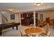 Spacious finished basement featuring a kitchen area, pool table, and dining space at 5361 Ashby Ct, Greenwood, IN 46143