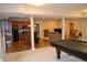 Finished basement boasting a kitchen, living area, and recreational space at 5361 Ashby Ct, Greenwood, IN 46143