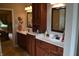 Bright bathroom featuring double sinks with ample counter space and cabinet storage, and a view to the bedroom at 5361 Ashby Ct, Greenwood, IN 46143