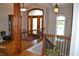 Grand foyer featuring hardwood floors, a decorative front door, and elegant light fixtures, welcoming guests at 5361 Ashby Ct, Greenwood, IN 46143