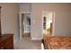 Spacious main bedroom featuring neutral walls, plush carpeting, and easy access to ensuite bathroom and walk-in closet at 5361 Ashby Ct, Greenwood, IN 46143