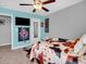 This bedroom features a ceiling fan and unique bedspread at 546 Freedom Dr, Pittsboro, IN 46167