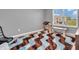 Cozy bedroom featuring a unique wavy rug, neutral walls, and a window with bright natural light at 546 Freedom Dr, Pittsboro, IN 46167
