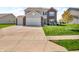 Beautiful two-story home featuring a two-car garage, brick accents, well-manicured lawn, and a concrete driveway at 546 Freedom Dr, Pittsboro, IN 46167