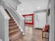 Bright foyer features hardwood floors, staircase, and a welcoming entrance at 546 Freedom Dr, Pittsboro, IN 46167