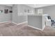 Upstairs hallway with neutral paint, carpet flooring, and decorative wall art for a cozy feel at 546 Freedom Dr, Pittsboro, IN 46167