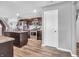 Modern kitchen featuring stainless steel appliances, hardwood floors, and granite countertops at 546 Freedom Dr, Pittsboro, IN 46167