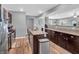 Open concept kitchen with granite countertops, stainless steel appliances, and ample cabinet space at 546 Freedom Dr, Pittsboro, IN 46167