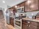 Well-equipped kitchen with stainless steel appliances, granite countertops, and custom cabinetry at 546 Freedom Dr, Pittsboro, IN 46167