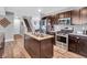Stylish kitchen featuring stainless steel appliances, granite countertops, and hardwood floors at 546 Freedom Dr, Pittsboro, IN 46167