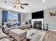 Comfortable living room with a fireplace, tv, and blue accents at 546 Freedom Dr, Pittsboro, IN 46167