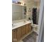 Functional bathroom with double sink vanity and a shower-tub combination with patterned curtain at 5640 Dapple Ct, Indianapolis, IN 46228