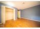 Spacious bedroom featuring hardwood floors and a double-door closet for ample storage at 5829 Lasalle St, Indianapolis, IN 46220