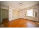 Bright bedroom with hardwood floors, ample closet space, and unique wallpaper adds character and functionality at 5829 Lasalle St, Indianapolis, IN 46220