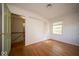 A room with hardwood floors and natural light creates an inviting space with a view to the hallway at 5829 Lasalle St, Indianapolis, IN 46220