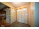 Welcoming foyer featuring a tile floor, a double-door entry and coat closet at 5829 Lasalle St, Indianapolis, IN 46220
