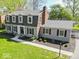 Aerial view of a two-story home with landscaped yard and inviting front entrance at 5829 Lasalle St, Indianapolis, IN 46220