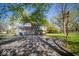 Spacious driveway leading to an attached garage, with a well-kept backyard at 5829 Lasalle St, Indianapolis, IN 46220