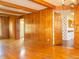 Hardwood floors and wood paneling add charm to this spacious living area at 5829 Lasalle St, Indianapolis, IN 46220
