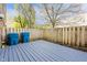 This home features a wood deck and mature trees, creating a private outdoor space at 6026 Oakbrook Ln, Indianapolis, IN 46254