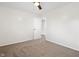 Spacious bedroom with neutral walls, carpet, and a ceiling fan, offering a cozy feel at 6026 Oakbrook Ln, Indianapolis, IN 46254