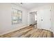 Bright bedroom with new flooring and ample natural light, creating a comfortable and inviting space for relaxation at 6026 Oakbrook Ln, Indianapolis, IN 46254