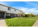 Well-maintained townhome features a neatly manicured lawn and convenient access to nearby amenities and green spaces at 6026 Oakbrook Ln, Indianapolis, IN 46254