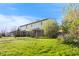 Spacious townhome boasts a lush green lawn, and mature trees, creating a serene and picturesque setting at 6026 Oakbrook Ln, Indianapolis, IN 46254