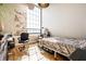 Bright bedroom with large window and exposed brick wall creating a modern and inviting atmosphere at 624 E Walnut St # 46, Indianapolis, IN 46204