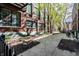 Beautifully landscaped courtyard with mature trees and walking paths, bordered by a black metal fence at 624 E Walnut St # 46, Indianapolis, IN 46204