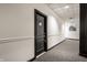 Hallway of the property with carpeting, painted walls, and door number 46 at 624 E Walnut St # 46, Indianapolis, IN 46204