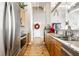 Spacious kitchen with stainless steel appliances, granite countertops, and a light-filled entryway at 624 E Walnut St # 46, Indianapolis, IN 46204