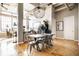 Bright living room with large windows, hardwood floors, and stylish furnishings in an open-concept layout at 624 E Walnut St # 46, Indianapolis, IN 46204