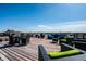 Expansive rooftop deck featuring multiple seating areas, ideal for entertaining and enjoying the outdoors at 624 E Walnut St # 46, Indianapolis, IN 46204
