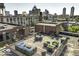 Stylish rooftop deck with city views, featuring comfortable seating and modern design at 624 E Walnut St # 46, Indianapolis, IN 46204