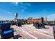 Rooftop deck boasts city views and lounge seating, ideal for relaxation at 624 E Walnut St # 46, Indianapolis, IN 46204