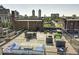 Beautiful rooftop deck overlooking the city, complete with modern furniture and stylish design at 624 E Walnut St # 46, Indianapolis, IN 46204