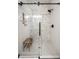 Modern shower with glass door, geometric tile, and built-in niche, providing a luxurious bathing experience at 624 E Walnut St # 46, Indianapolis, IN 46204