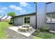 Siding house with a concrete patio featuring a picnic table in the spacious backyard at 660 Sun Valley Ct, Indianapolis, IN 46217