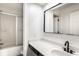 Bright bathroom featuring a modern vanity with matte black faucet and a shower with sliding glass doors at 660 Sun Valley Ct, Indianapolis, IN 46217