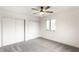 Bedroom featuring a ceiling fan and closet with slider doors at 660 Sun Valley Ct, Indianapolis, IN 46217
