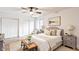 Cozy bedroom with soft lighting, hardwood floors and a comfortable bed with decorative pillows, creating a serene and inviting space at 660 Sun Valley Ct, Indianapolis, IN 46217