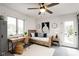 Bright bedroom featuring a daybed, a wooden desk and a neutral color scheme, perfect for relaxing or studying at 660 Sun Valley Ct, Indianapolis, IN 46217