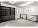 Bonus room with custom built-in shelves, statement ceiling and modern light fixture at 660 Sun Valley Ct, Indianapolis, IN 46217