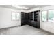 Bonus room with custom built-in shelves, bright windows and plush carpet at 660 Sun Valley Ct, Indianapolis, IN 46217