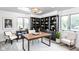 Sophisticated office featuring custom shelving, a modern desk and oversized windows, perfect for working from home at 660 Sun Valley Ct, Indianapolis, IN 46217