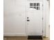 Interior white door with black handle, next to white walls with trim, and modern flooring at 660 Sun Valley Ct, Indianapolis, IN 46217