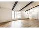 Spacious living area with hardwood floors, vaulted ceilings, white walls, and bright natural light at 660 Sun Valley Ct, Indianapolis, IN 46217